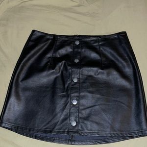Black leather skirt with fake front buttons and zipper in back